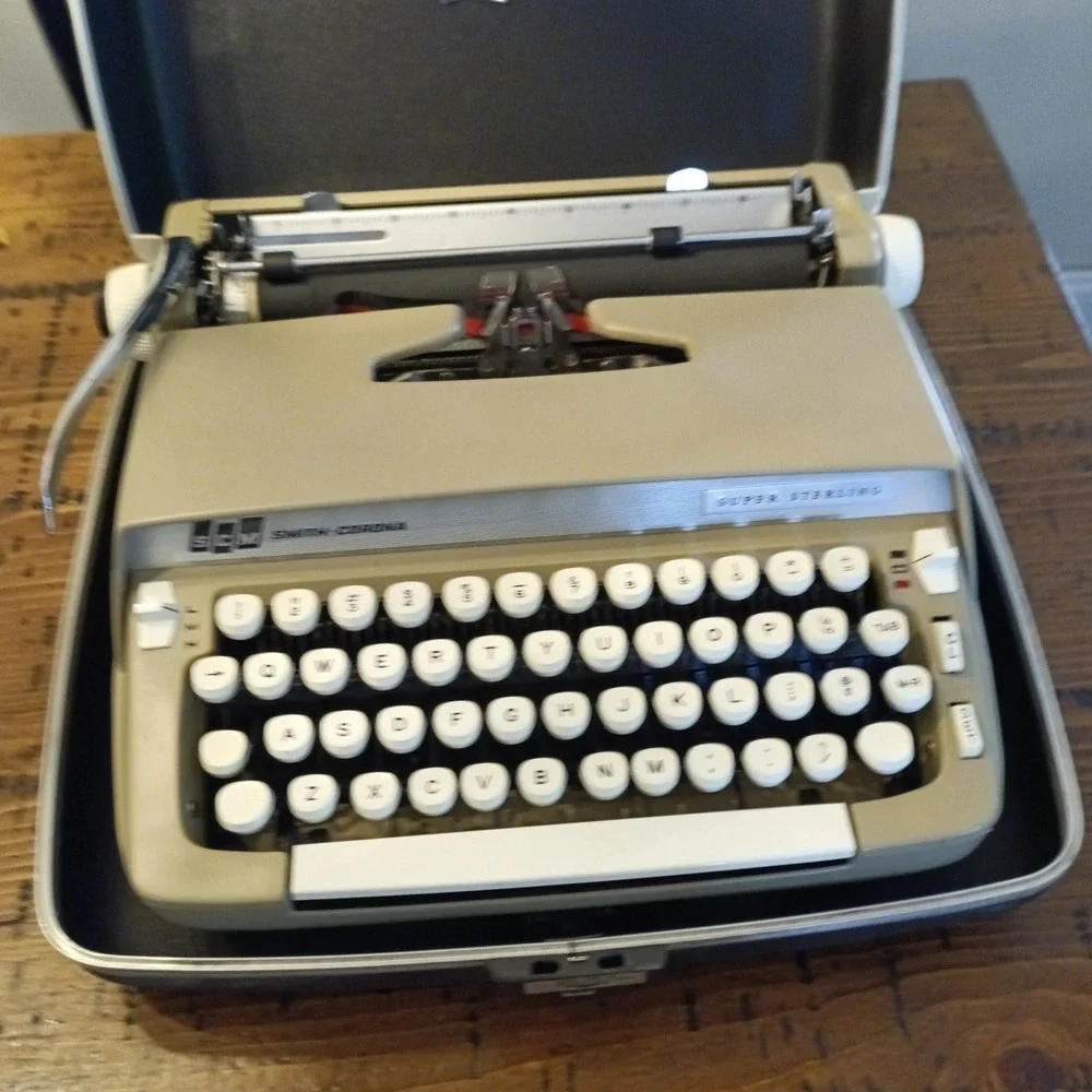 SCM Smith-Corona Super Sterling Portable Manual Typewriter with Case and Key
